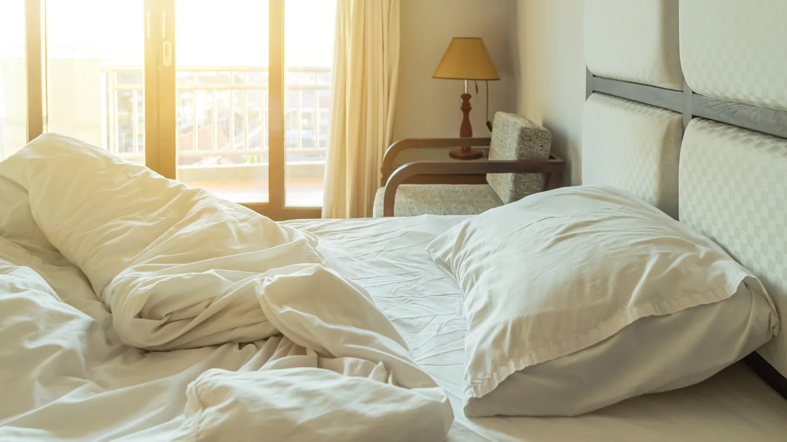 Unmade bed in morning light