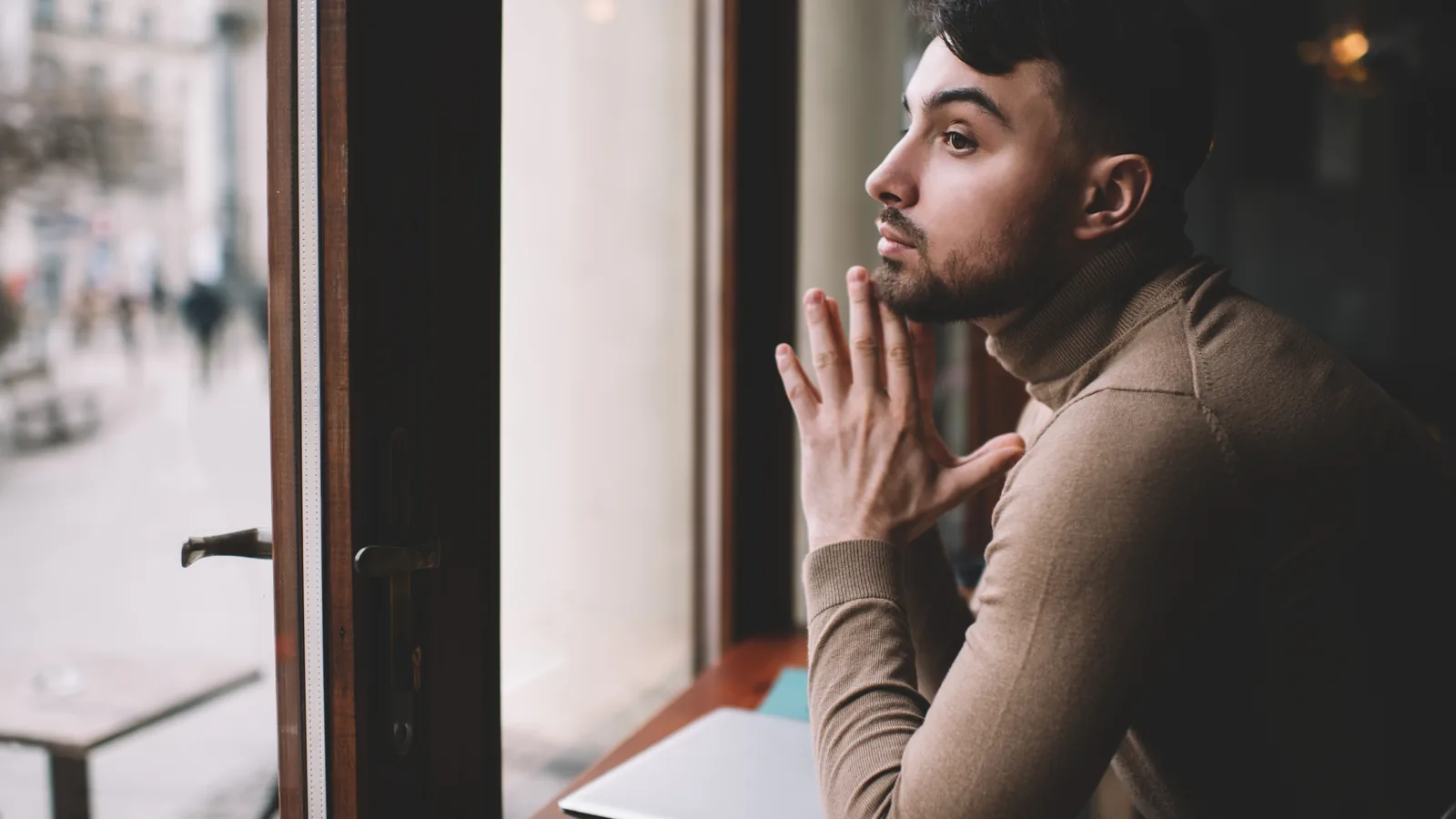 Man looking out a window